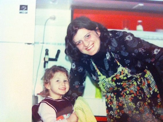 My mother and I in a kitchen when I was a kid.