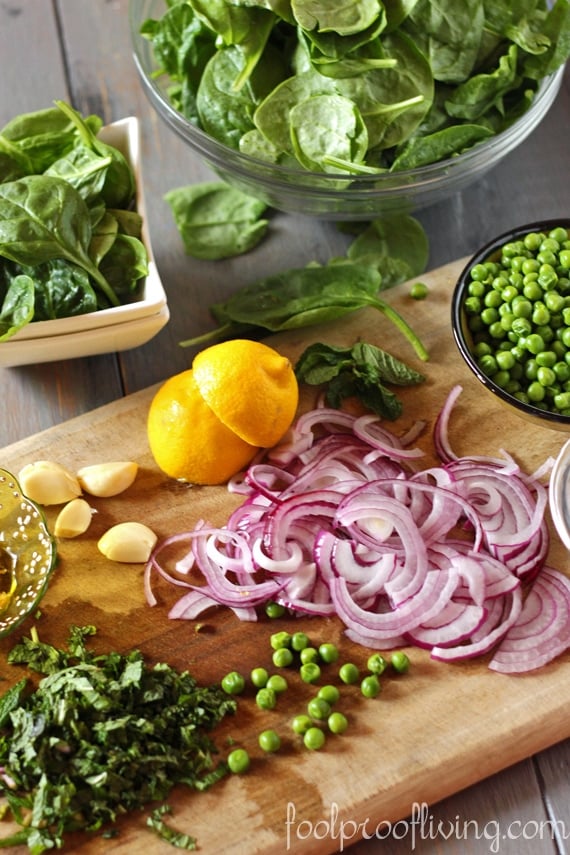 Spinach shrimp salad ingredients - red onions, peas, spinach