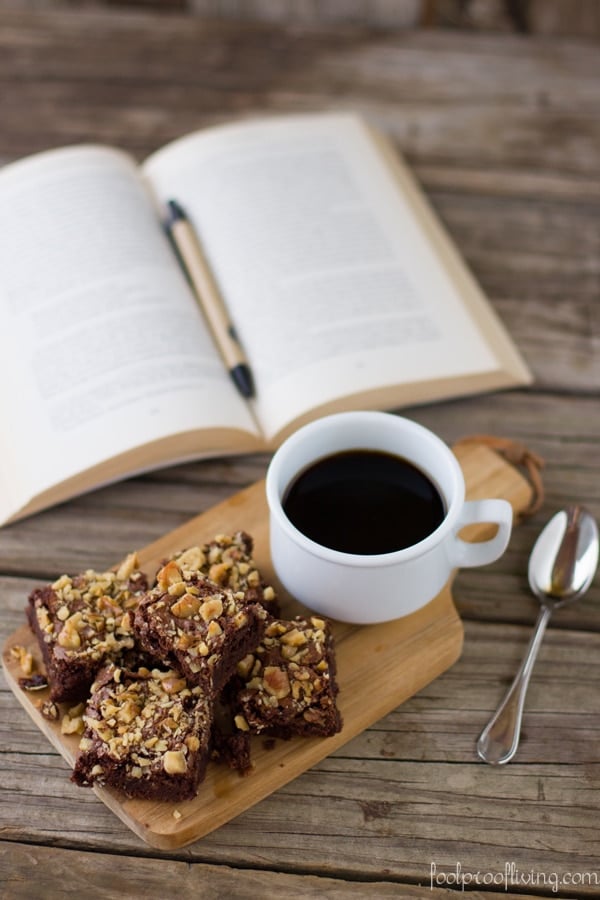 Cake flour brownies placed next to a cup of coffee