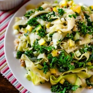 A plate full of this zucchini kale garnished with sesame seeds.