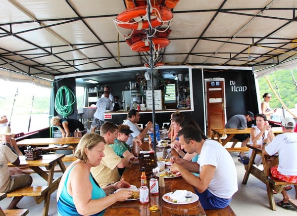 People are eating in a boat 