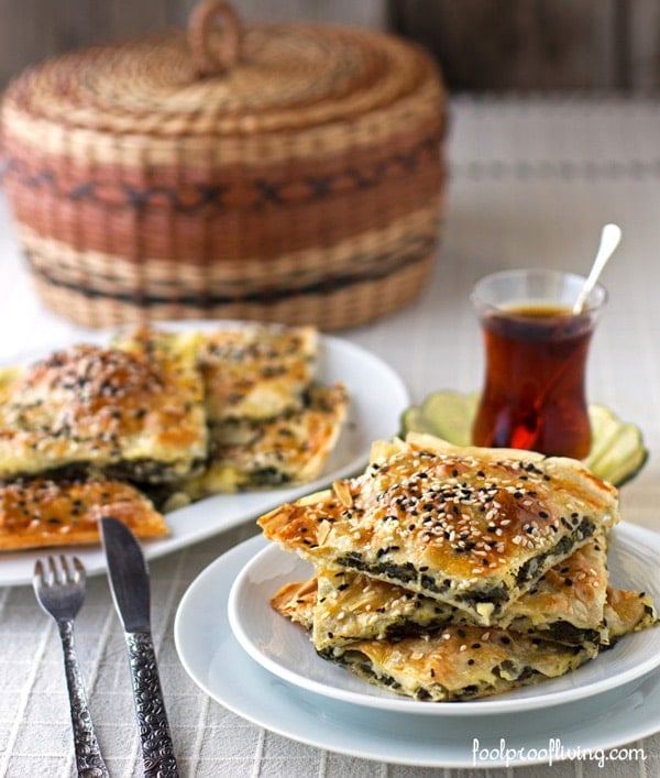 A few slices of Spinach Borek Recipe served with tea on the side