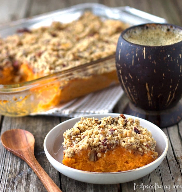 Trisha Yearwood's Sweet Potato Soufflé in a plate with a spoon on the side