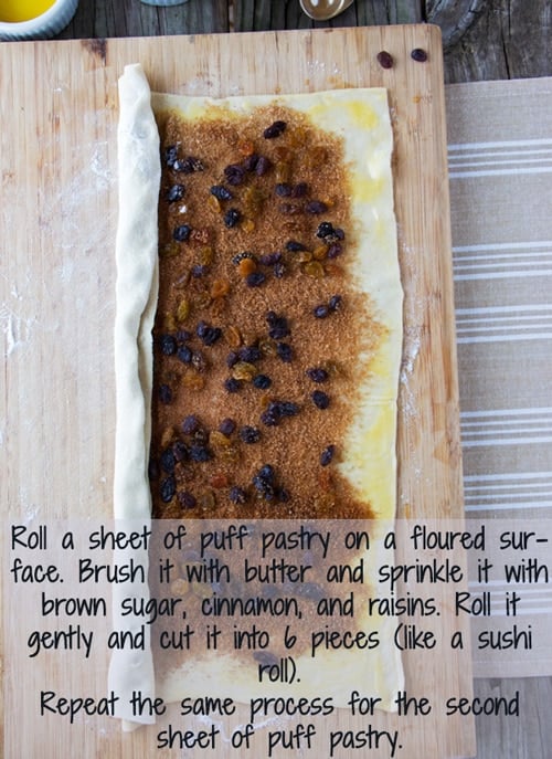 Easy Sticky Buns being rolled with raisins in them. 