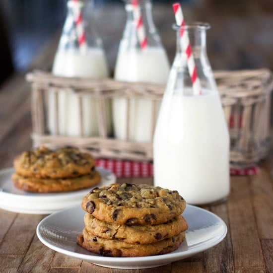 Double tree cookies placed on a plate with milk on the side.