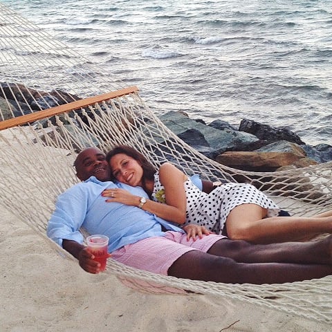 Two people in a hammock on the beach