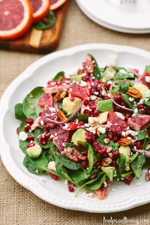 Baby Spinach Salad with Blood Oranges on a white plate