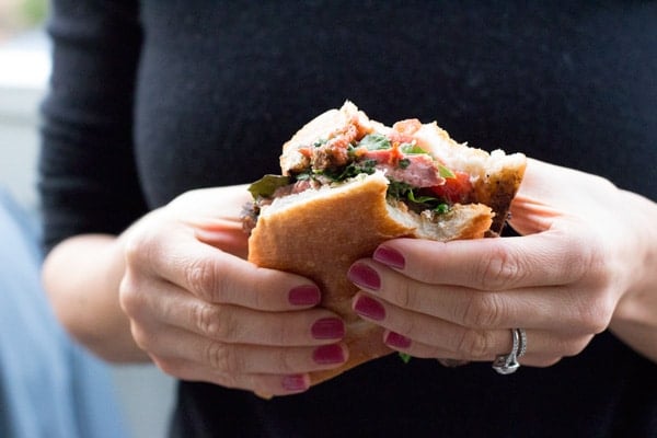 Person holding a Steak Sandwich