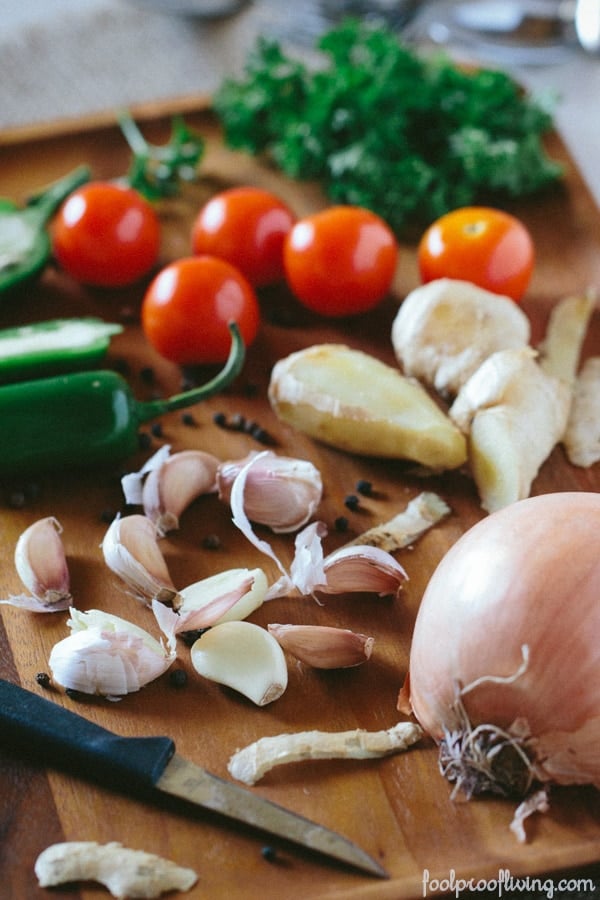 Ingredients for Chicken Curry recipes on a cutting board and knife