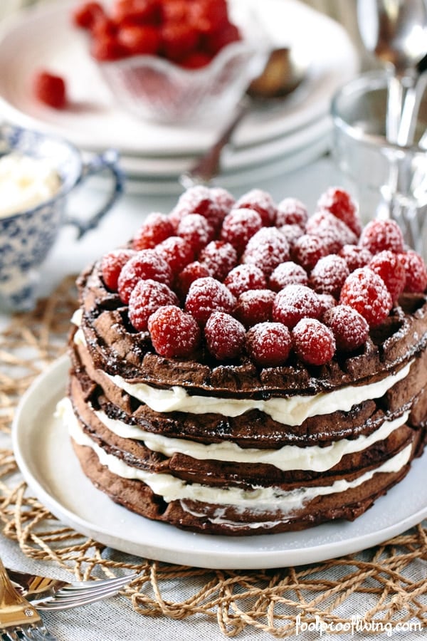 Dark Chocolate Waffle Cake with Mascarpone Whipped Cream with raspberries on top