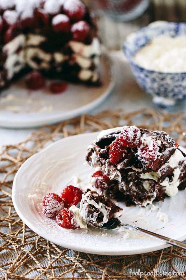 A single serving of Dark Chocolate Waffle Cake with Mascarpone Whipped Cream on a plate