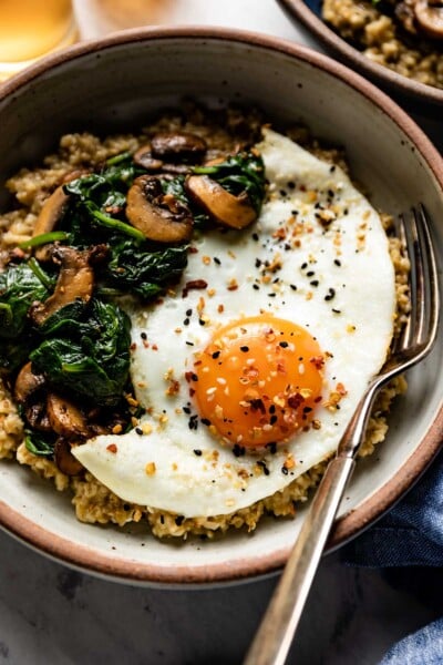 Savory steel cut oatmeal topped of with sauteed mushroom, spinach and a fried egg.