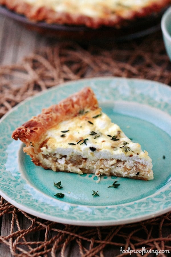 Goat Cheese Quiche with Caramelized Onions and Thyme placed on a plate