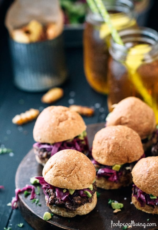 5 Vegan Sloppy Joe's with 2 glasses of tea and tin in the background
