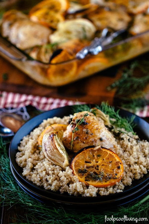 Roasted Orange chicken placed in a bed of bulgur photographed from the front close up view