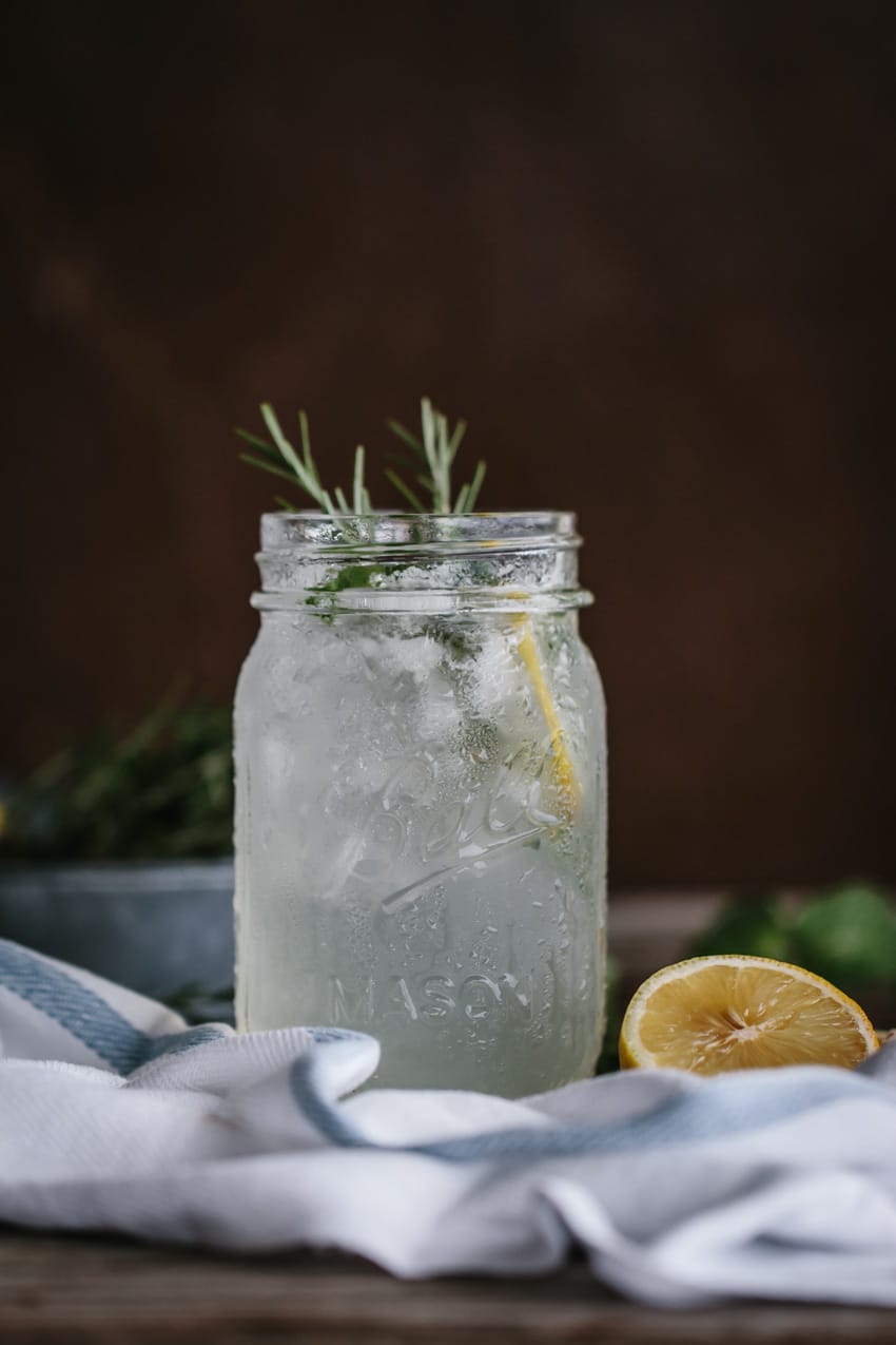 Fresh Mint Lemonade photographed with a garnish of rosemary from the front view.