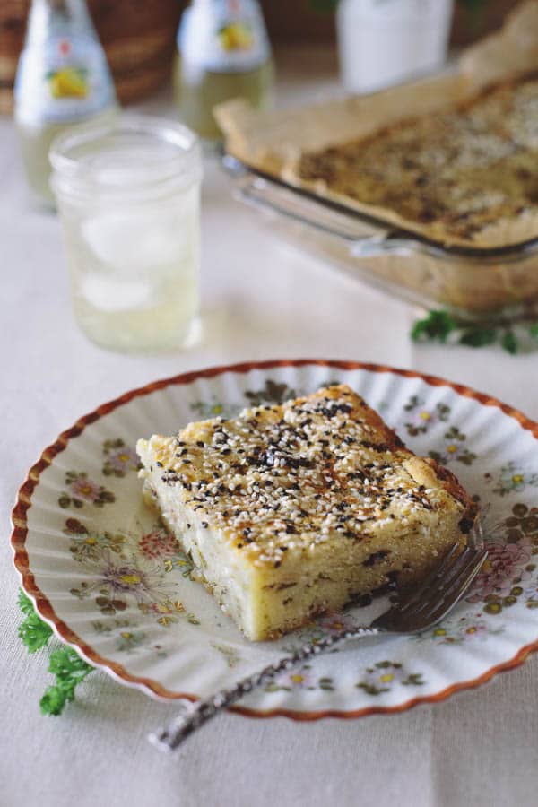 A slice of Savory Feta Cheese and Kalamata Olive Cake on a small plate