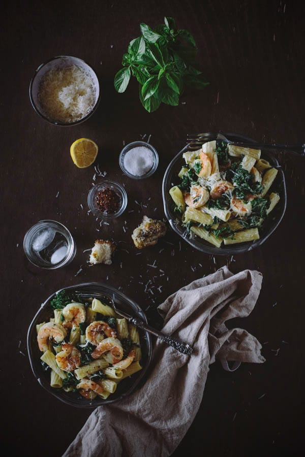 Two bowls of kale shrimp pasta