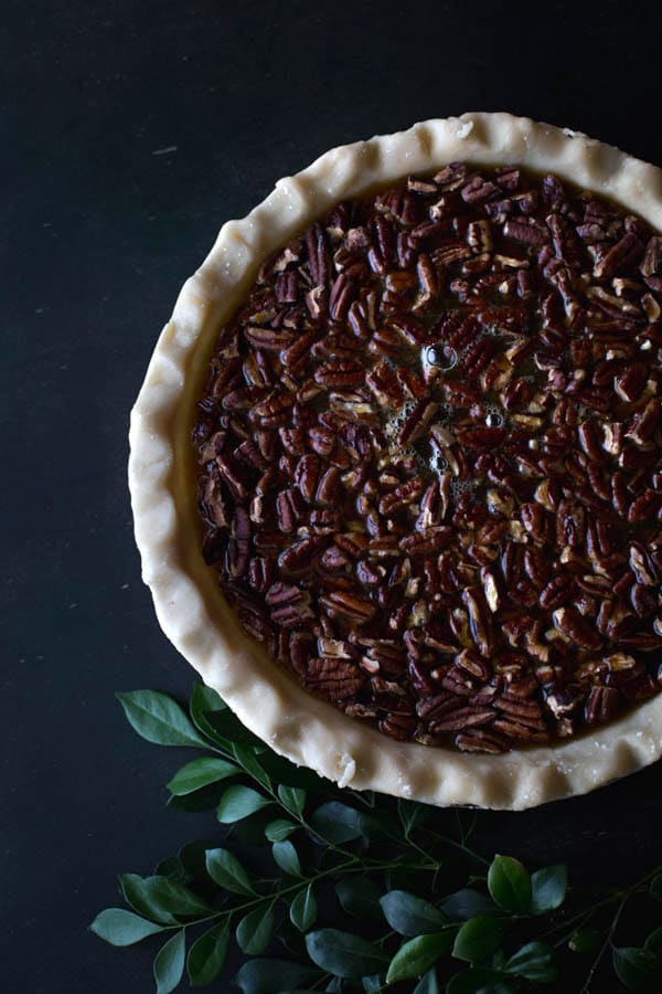 Top view of an Old-Fashioned Maple Pecan Pie with Bourbon Whipped Cream