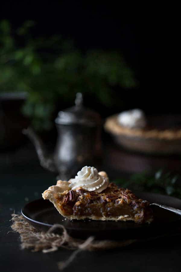 Single slice of homemade pie with Bourbon Whipped Cream