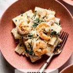 Rigatoni with creamy ricotta pasta sauce with shrimp in a bowl.