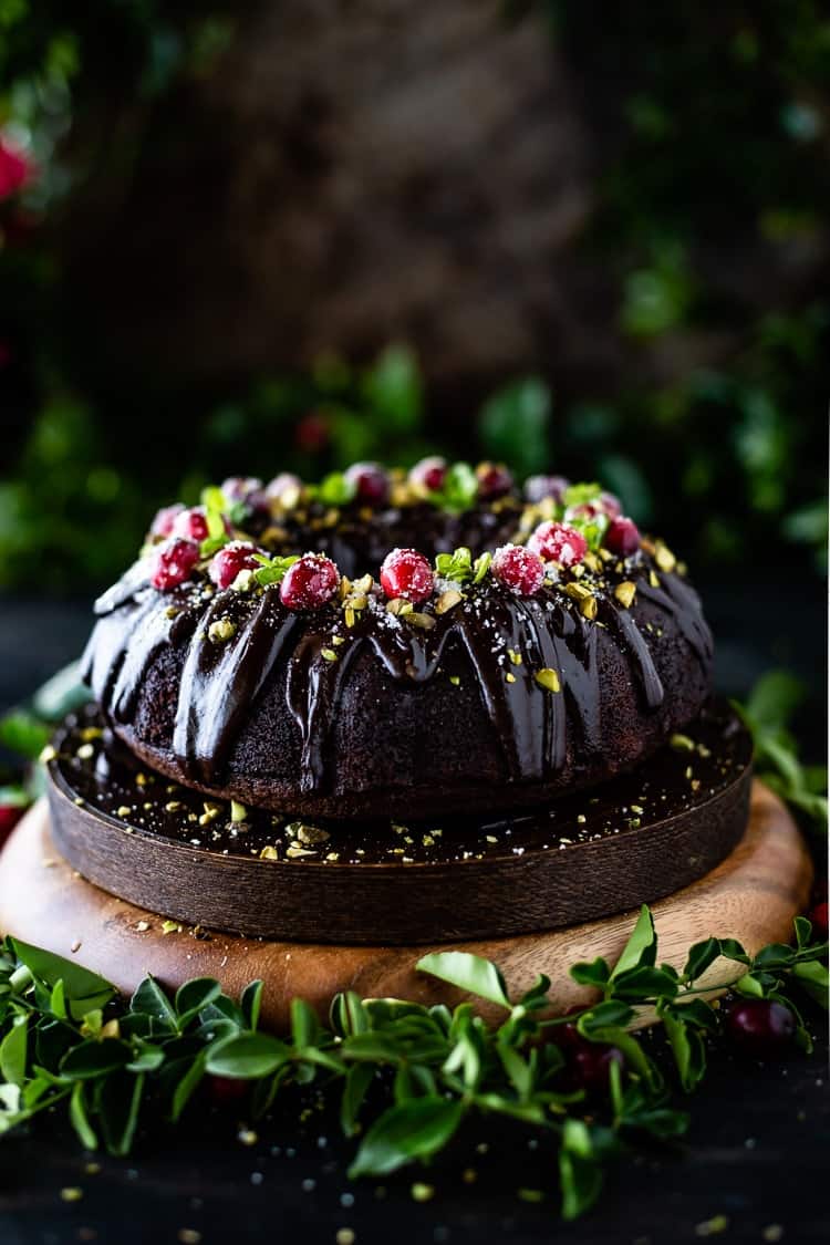 Chocolate Bundt Cake garnished with sugared cranberries