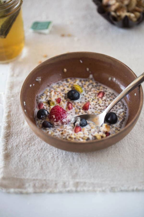 half eaten buckwheat overnight oats placed in a bowl with fruit