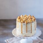 Banana Cake with Caramel Frosting on a cake stand from the front view