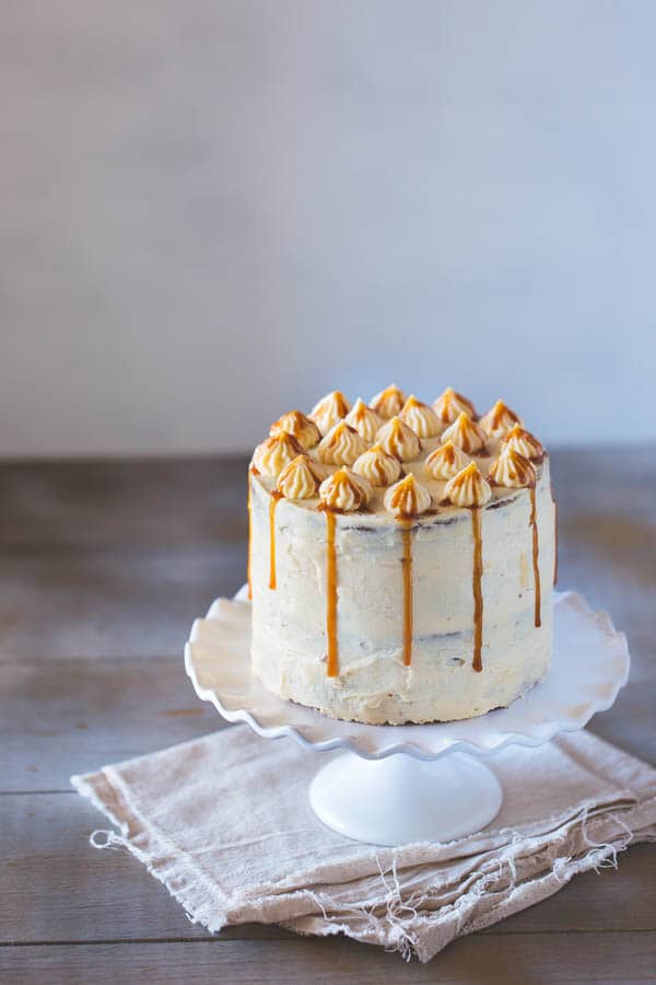 Banana Cake with Caramel Frosting placed on a cake stand