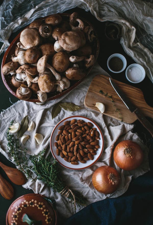 Ingredients for almond puree with onions, garlic and herbs on a cloth