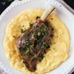 Braised Lamb Shanks with Mustard and Gremolata on a plate
