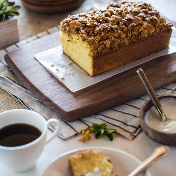 Sliced Orange Polenta Cake with Almond and Oat Streusel with a cup of coffee