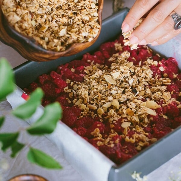 Almonds being poured in Raspberry mix for Breakfast Bars