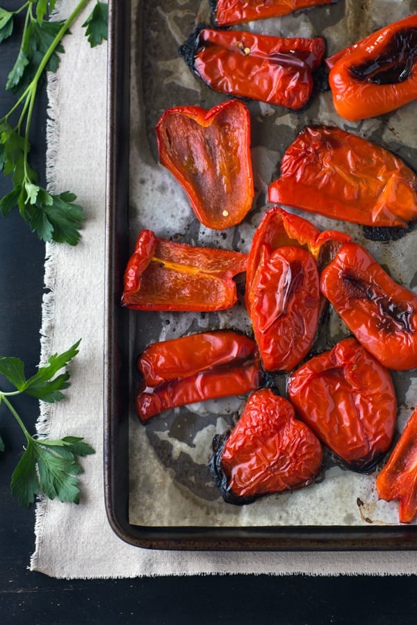 Red peppers are roasted to make Roasted Red Pepper Dip and photographed from the top view.