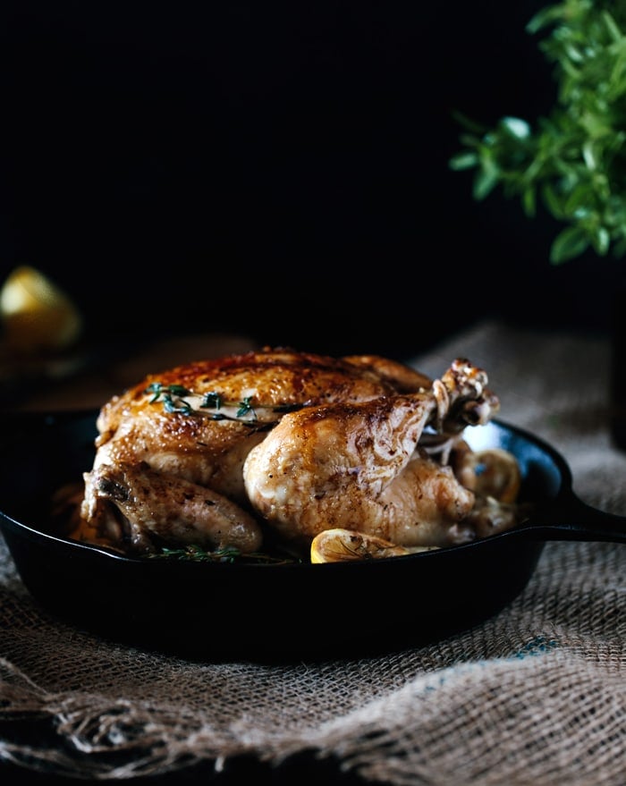 Close up view of  Roast Chicken in a cast iron skillet