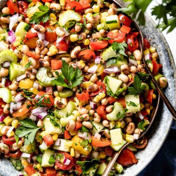 Black Eyed Pea Salad in a bowl from the top view with spoons on the side