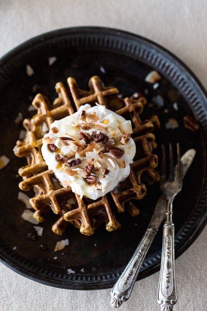 Overhead close up view of Spicy Pumpkin Waffles with Coconut Whipped Cream