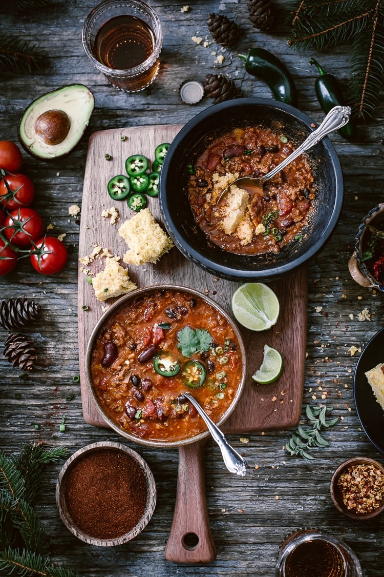 Three Bean Turkey Chili filled bowls photographed from the top view.