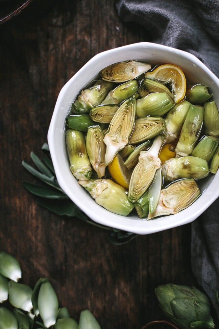 Close up view of sliced artichokes in a bowl