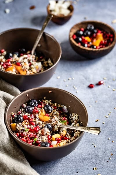 Coconut Milk Quinoa Porridge served in a bowl with fruits on top