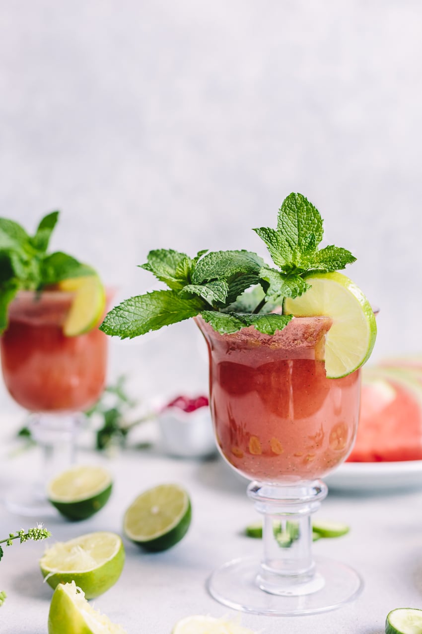 2 cups of Minty Watermelon Cucumber Smoothie garnished with mint and lime