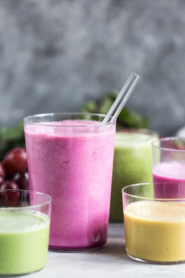 Beet smoothies made with golden beets, red beets, and spinach are in glasses. 