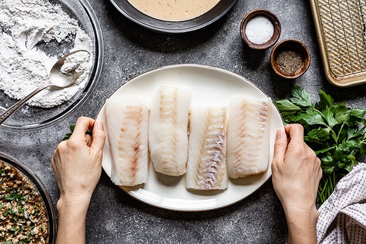 Baked Breaded Fish Fillet as they are placed on a plate