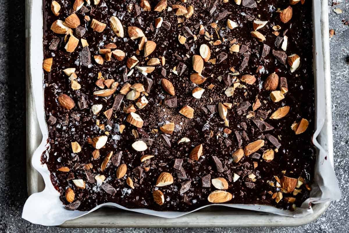 Brownies with spelt flour in a sheet pan from the top view.