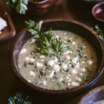 A bowl of Feta Broccoli Soup garnished with parsley