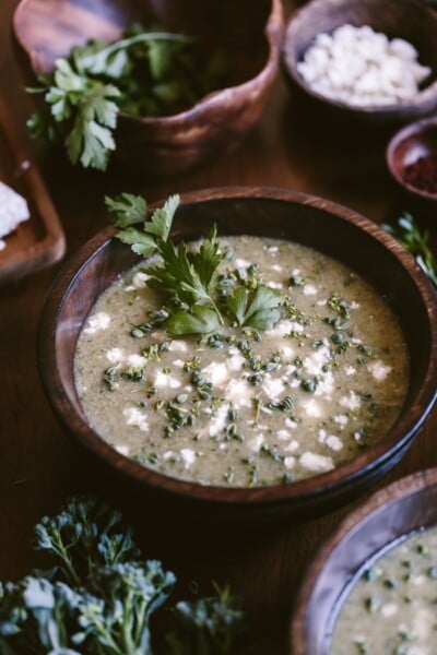 A bowl of Feta Broccoli Soup garnished with parsley