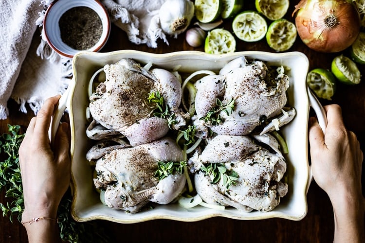 Raw Cornish Hens placed in a large dish - Learn how long does it take to cook a cornish hen