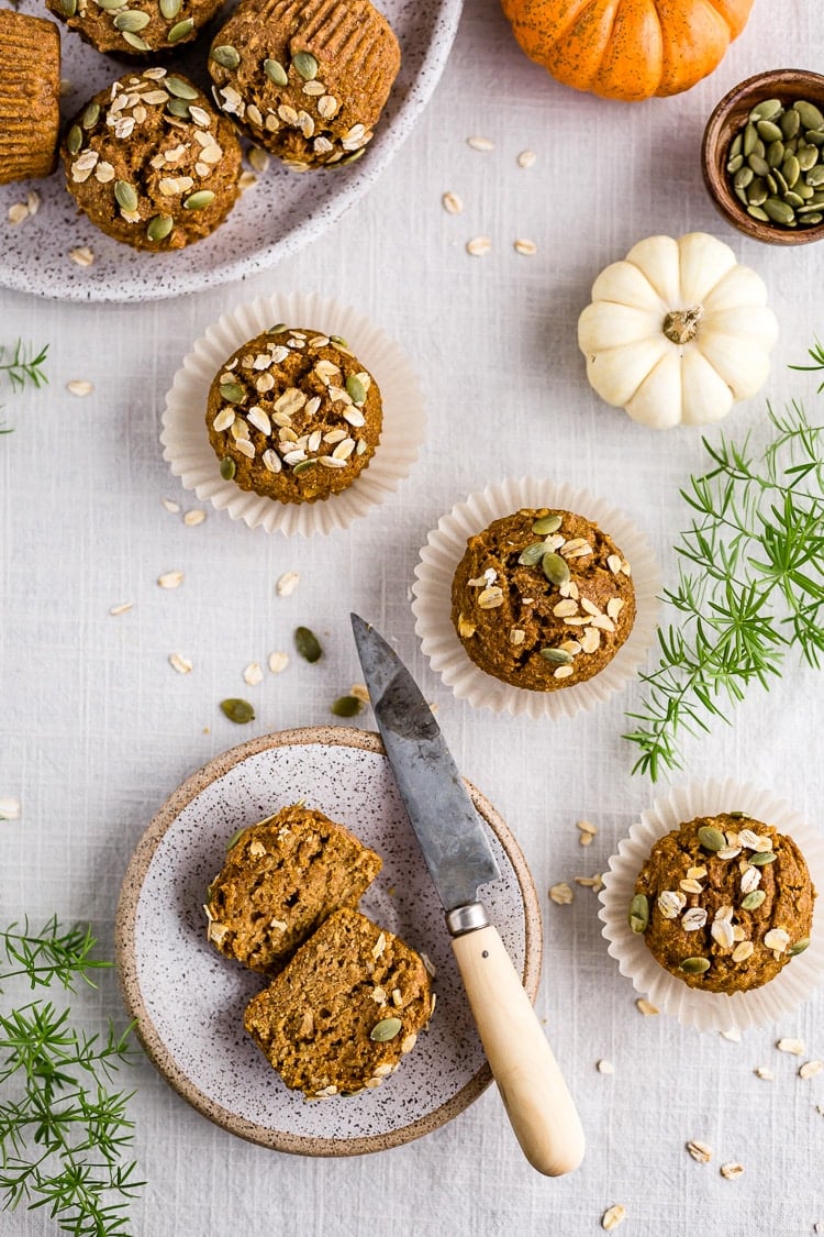 Healthy Pumpkin Breakfast Muffins with Coconut oil on a plate scattered