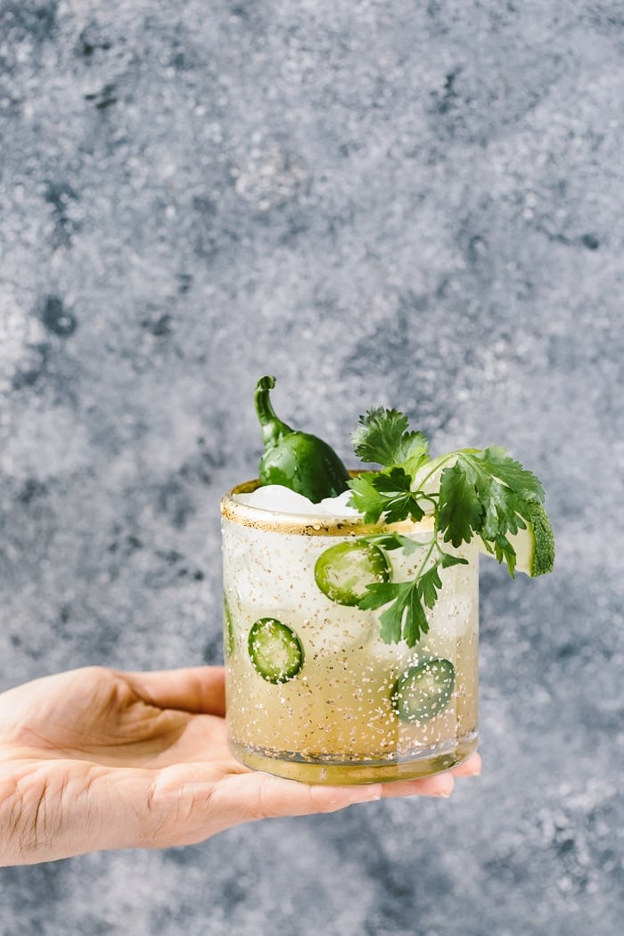 Spicy Jalapeno Margaritas is in the hands of a woman
