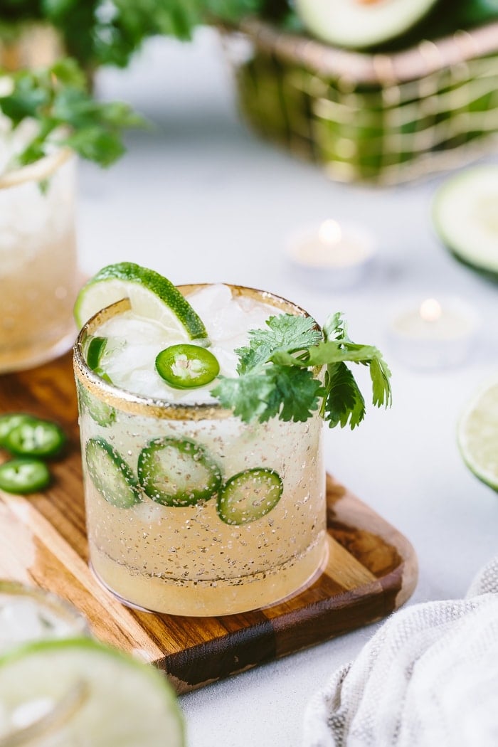 Spicy Margarita Recipe on a wooden boar garnished with lime